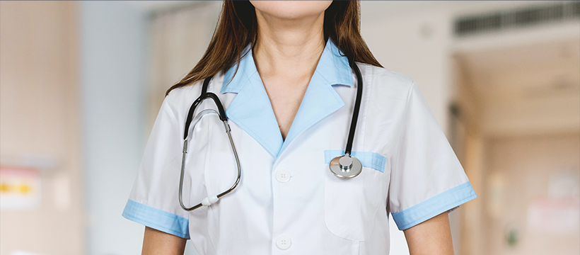 a nurse standing with a stethoscope over her shoulder